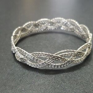 Silver tone braided bangle bracelet 7.75"